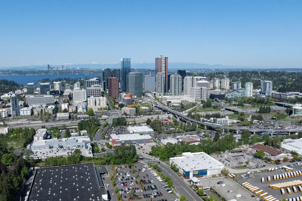 Aerial view of downtown Bellevue, Washington, with Lake Washington in the distance